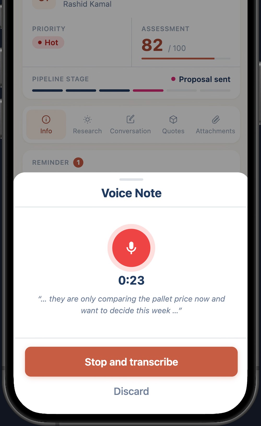 Recording a voice note on the phone at the booth, with the live transcript and a button to stop and transcribe